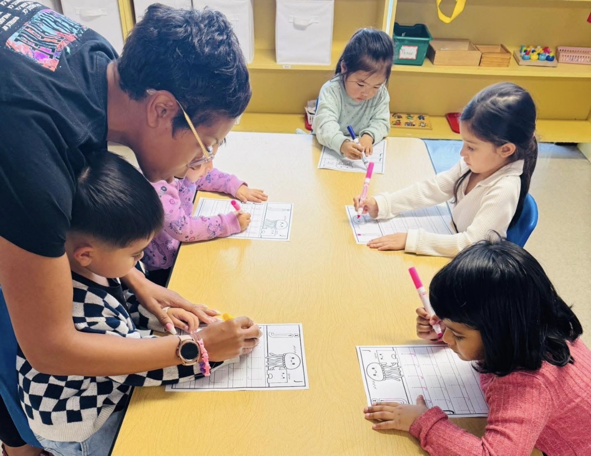 Children engaged in learning activities at Adventure Montessori Academy